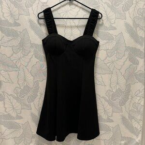 Large Short Black Dress with Exaggerated Décolletage